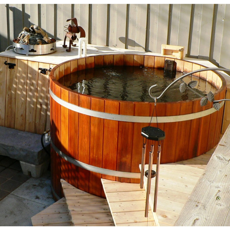 Northern Lights Cedar Hot Tub On backyard stone patio