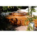 Northern Lights Cedar Hot Tub with jets set into custom deck on back patio