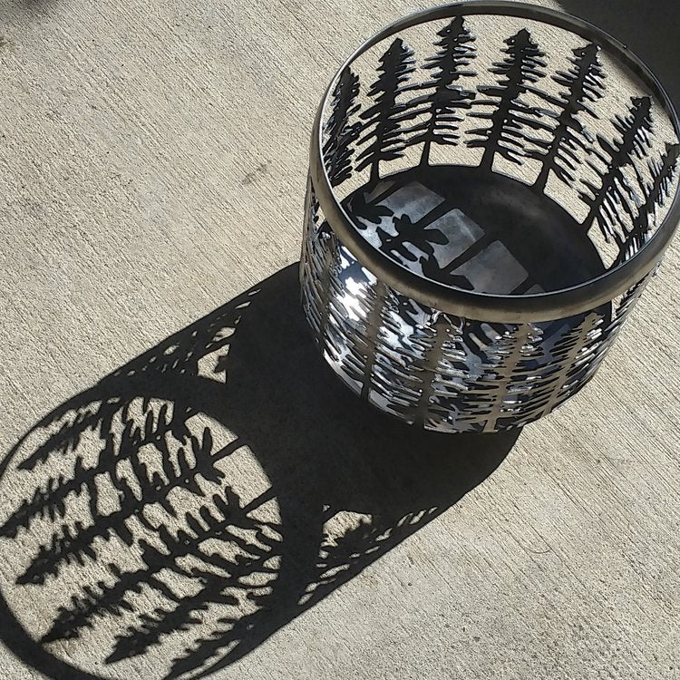 Sitka Fire Pit with raw steel finish in sunlight with long shadow.