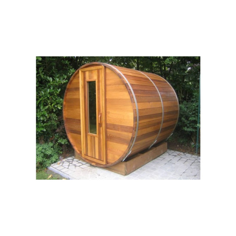 Northern Lights Red Cedar Barrel Sauna on stone patio