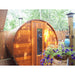 Northern Lights Red Cedar Barrel Sauna on back deck with hanging flower basket