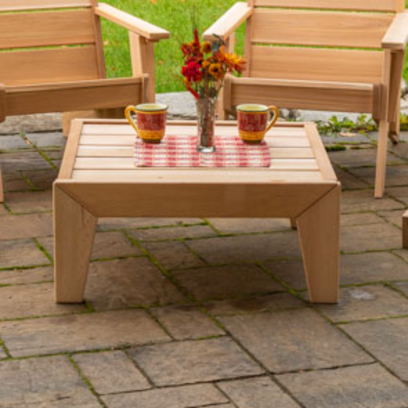 Dundalk Pacific Modern Coffee Table On Backyard Patio with Tea Cups and Flowers