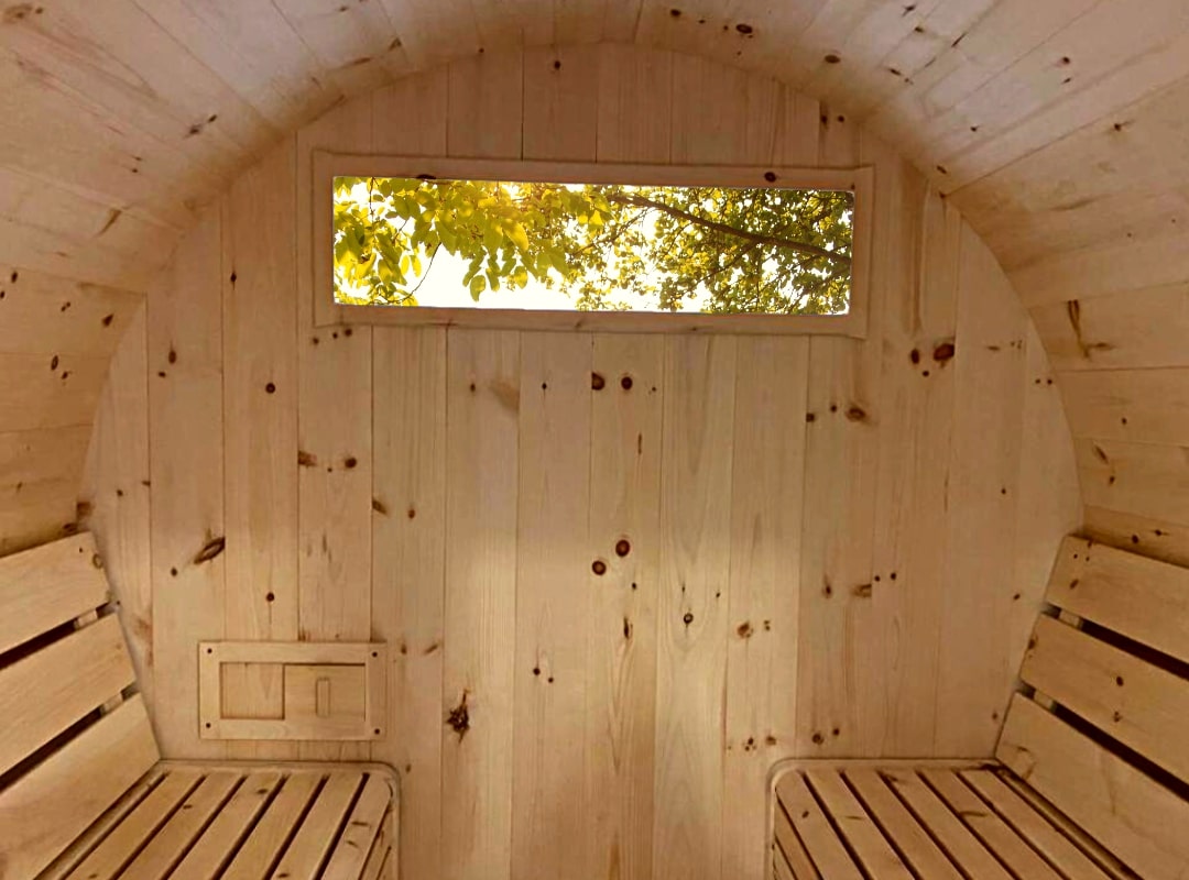 Inside view of True North Pine Barrel Sauna with back window, no heater.