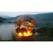 Savannah Fire Pit Sphere Next To Lake With Fire Showing Elephants and Monkey